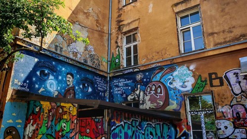 Colourful graffiti on an old building wall with windows and urban atmosphere, Ljubljana, Slovenia