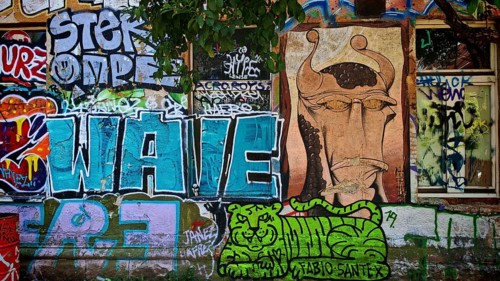 Colourful graffiti with various motifs on a brick wall in an urban environment, Ljubljana, Slovenia
