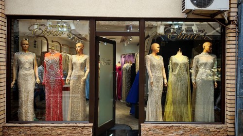 Elegant evening dresses in a boutique shop window, Ohrid, North Macedonia