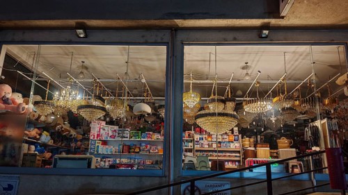 An illuminated shop with various lights and lamps in a shop window, Kosovo
