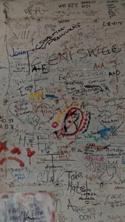 Colourful graffiti and doodles cover a wall, Pristina, Kosovo