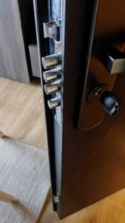 Close-up of an opened door lock with visible metal bolts, security in hotel, Kosovo