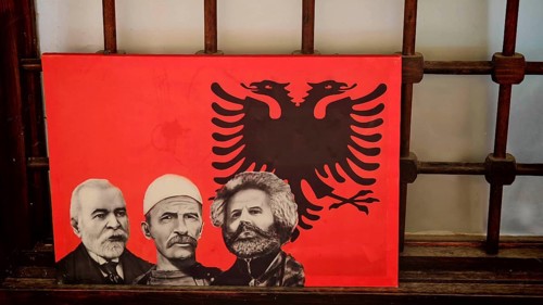 Red picture with three portraits and an Albanian eagle, Kosovo
