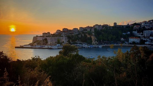 Sunset over the coast with historic buildings and sea view, Ulcinj, Montenegro