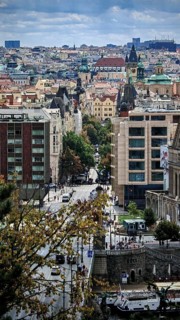 Urban view of buildings, roads and trees in a lively city, Prague, Czech Republic