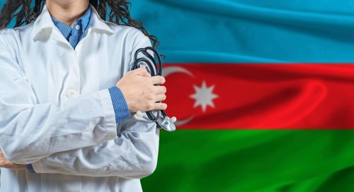 Healthcare professional with Azerbaijan flag background. Professional doctor holding stethoscope on