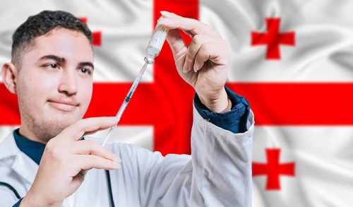 Doctor holding syringe on Georgia flag background. Medical professional holding syringe with
