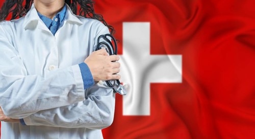 Healthcare professional with Switzerland flag background. Professional doctor holding stethoscope