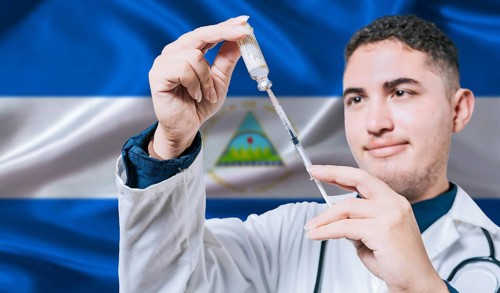 Doctor holding syringe on Nicaragua flag background. Medical professional holding syringe with