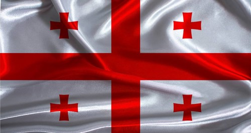 Georgia flag with cloth textured background. National flag of Georgia with realistic texture