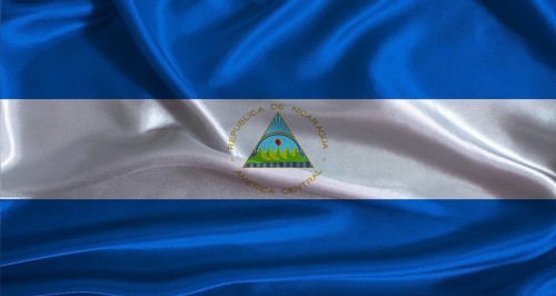 Nicaragua flag with cloth textured background. National flag of Nicaragua with realistic texture