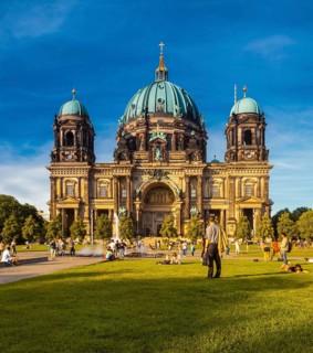 Berlin, Germany, Europe. The Berliner Dom with people enjoying the Summer sun