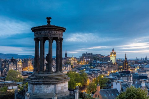 Edinburgh, Scotland, UK. The Dugald Stewart Monument on Calton Hill overlooking the old town in the