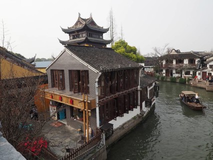 A Chinese-style building on the banks of a canal on a traditional boat, Zhujiajiao Ancient Town,
