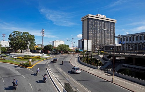 Street scene in zone 14, on the left the Peace Memorial or Monumento a la Paz, Guatemala City,