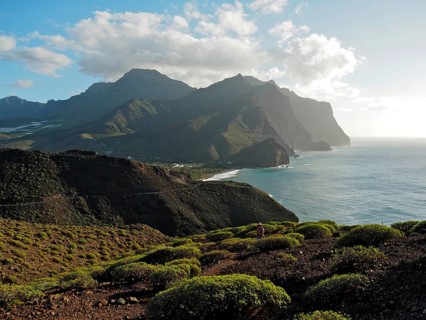 Coastal landscape with mountains and sea in soft light of evening sun, Puerto de la Aldea, Gran