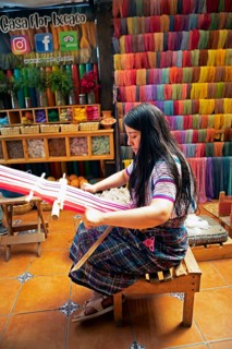 Maya woman, 42 years old, weaving with a back strap, traditional craft in a woman's cooperative,