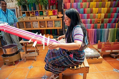 Maya woman, 42 years old, weaving with a back strap, traditional craft in a woman's cooperative,