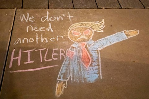 Phoenix, Arizona - Messages written in chalk on the sidewalk at the Arizona State Capitol during a