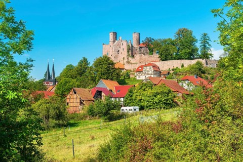 View of the ruins of Hanstein Castle and the small village of Rimbach, half-timbered houses and