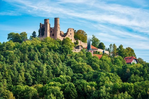 View of the ruins of Hanstein Castle and the small village of Rimbach, village church with