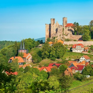 View of the ruins of Hanstein Castle and the small village of Rimbach, half-timbered village church