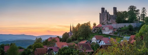 View of the ruins of Hanstein Castle and the small village of Rimbach with village church with