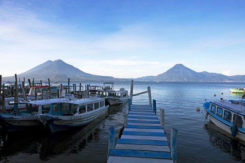 Boats on the pier, Lake Atitlán or Lake Atitlán in the morning, the volcanoes San Pedro, Atitlán