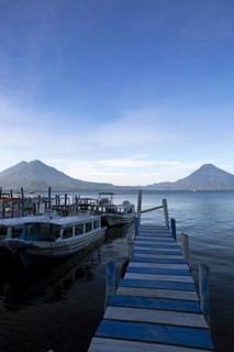 Boats on the pier, Lake Atitlán or Lake Atitlán in the morning, the volcanoes San Pedro, Atitlán