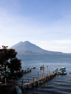 Boats on the dock, Lake Atitlán or Lake Atitlán in the morning, the volcanoes Atitlán and Toliman