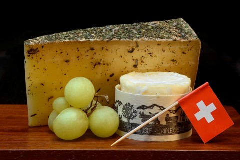 Plate of Swiss cheese, Gstaad mountain cheese with herbs and cream cheese 'Fette Berta',