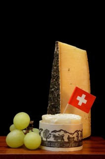 Plate of Swiss cheese, Gstaad mountain cheese with herbs and cream cheese 'Fette Berta',