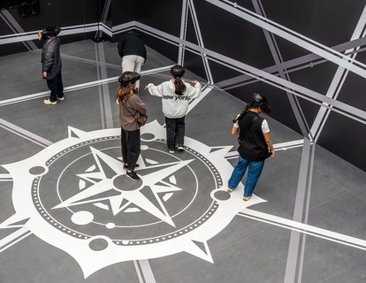 Visitors wearing VAR glasses at Louvre Abu Dhabi, art museum by French architect Jean Nouvel,