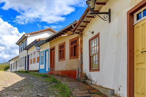 Picturesque street with colorful colonial houses, weathered by time, in Ouro Preto, Ouro Preto,