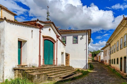 Historic chapel on a cobblestone street and old colonial houses in Ouro Preto, Ouro Preto, Minas