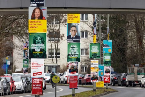 Numerous election posters for the 2026 local elections are hanging one behind the other on several