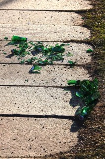 Broken glass on a sidewalk, danger to passers-by, cyclists and animals, Germany