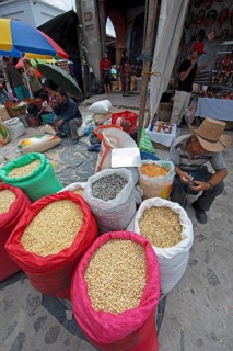 Different colored corn in bags for sale at the market in Chichicastenango, Highlands, El Quiché