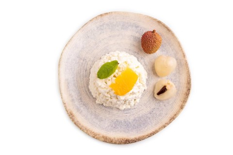 White ?ottage cheese, Curd, with orange and lychee isolated on white background, top view, flat