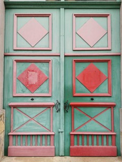 Colored door with geometric patterns in pink and green, Czech Republic