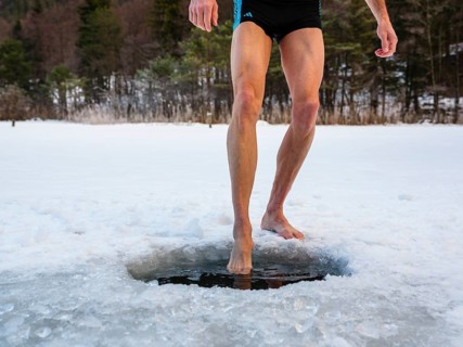 Naked men's legs at an ice hole, toes in water, Thumsee, Bad Reichenhall, Berchtesgadener Land,
