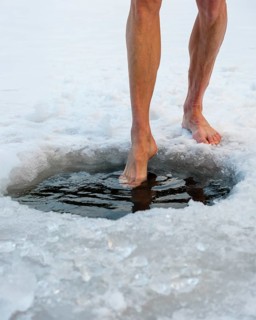 Naked men's legs at an ice hole, toes in water, Thumsee, Bad Reichenhall, Berchtesgadener Land,