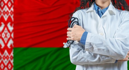 Healthcare professional with Belarus flag background. Professional doctor holding stethoscope on
