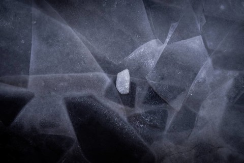 Ice sheets form abstract pattern on a frozen lake, ice, winter, Finland