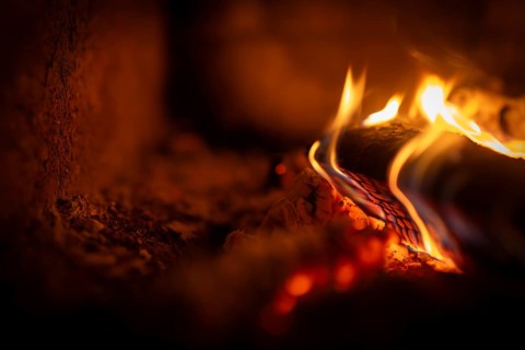 Burning wood, log, embers, fire in a fireplace