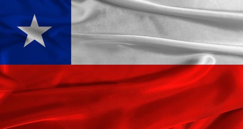 Flag of Chile with fabric textured background. Close up of National flag of Chile with realistic