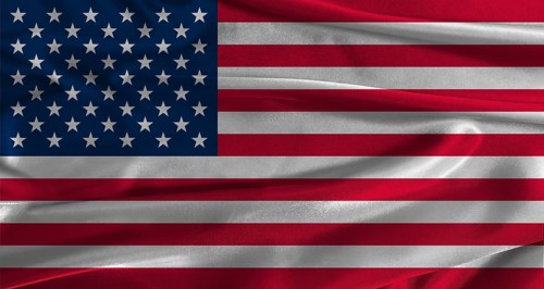 Flag of the United States with fabric textured background. Close up of National flag of the United