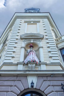 Mannequin in Ukrainian traditional costume in a niche at a 19th-century house, Czernowicz, Ukraine