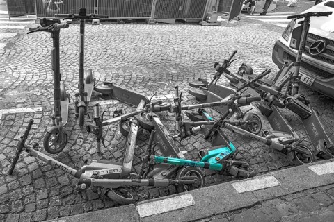 E-scooters thrown into the heap on the street after the e-scooter ban, black white, Paris, France