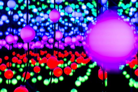 Light, glowing balls, LED lamps, hang in series, side by side, on top of each other, change their